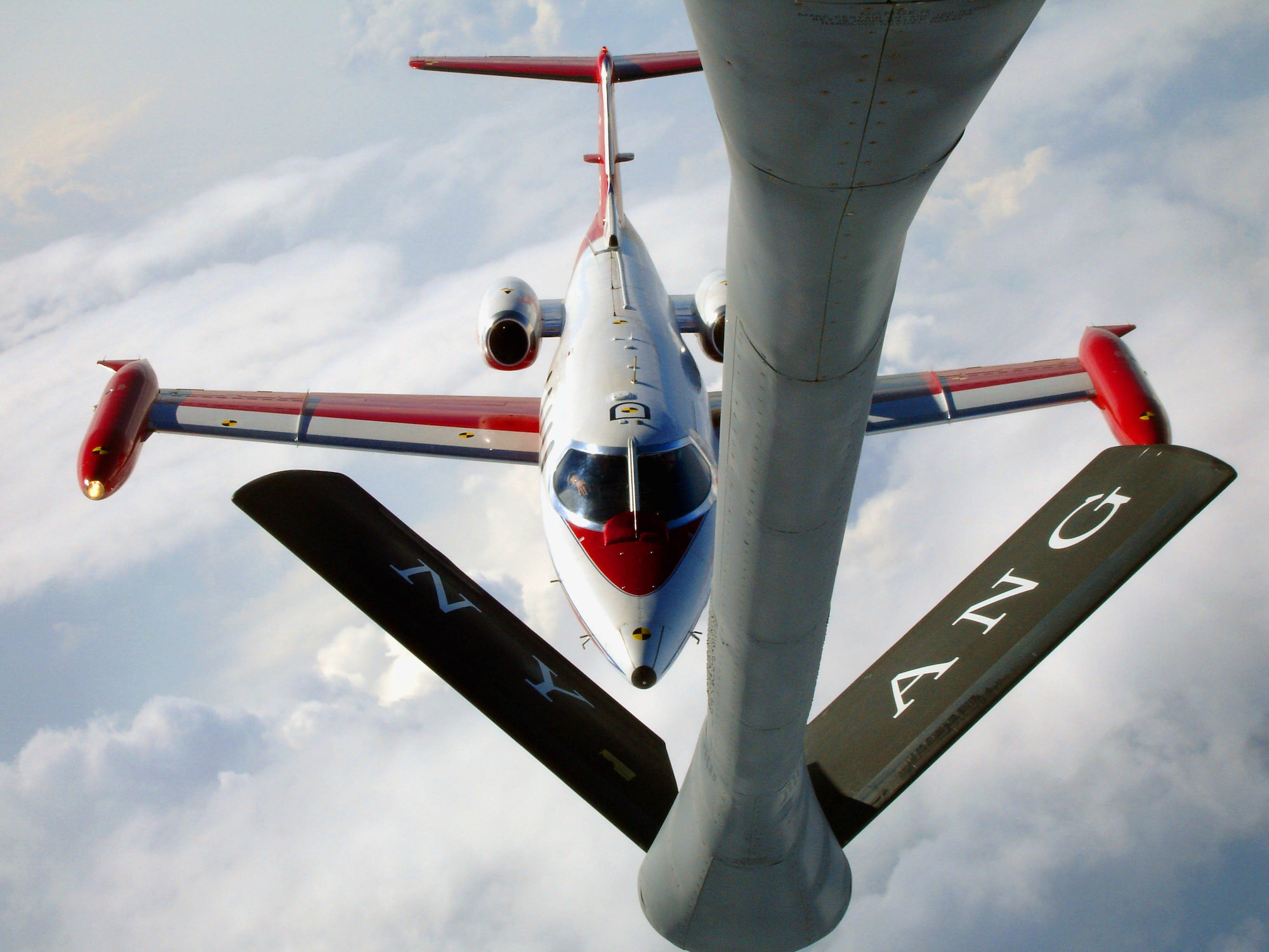 LAKE ONTARIO, N.Y. — A Carlspan Corporation Learjet, acting as a UAV surrogate, is flown to the contact position behind a KC-135R from the 107th Air Refueling Wing of the New York Air National Guard. (Air Force photo)