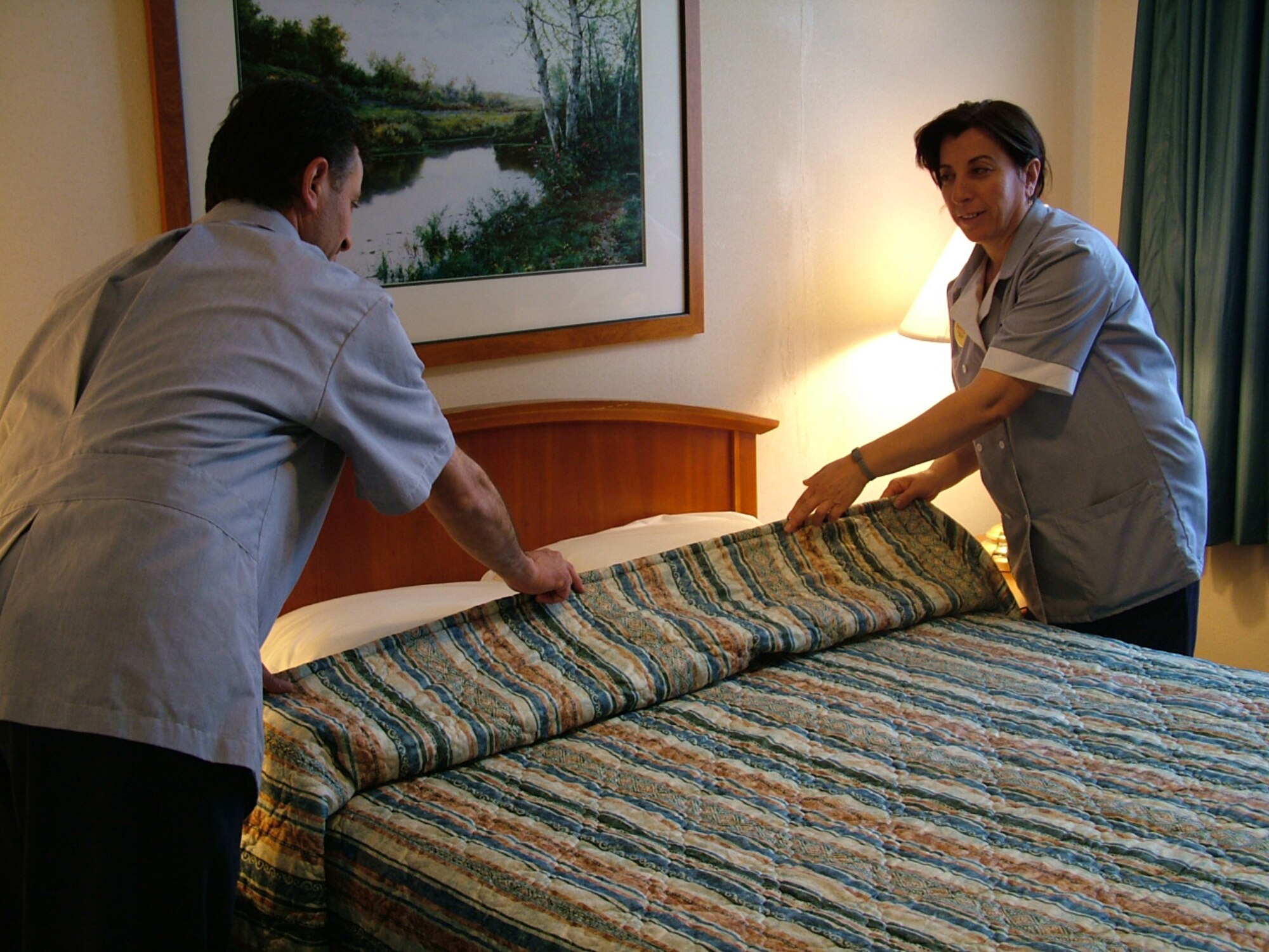 Two housekeepers make a bed at the Hodja Inn. The Hodja Inn was the winner of the 2006 Innkeeper Award. (Courtesy photo)