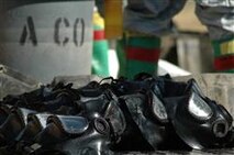 M-40 field protective masks dry in the sun after being decontaminated by Decontamination Team, Company A, Chemical Biological Incident Response Force, II Marine Expeditionary Force, following a live chemical-warfare agent training evolution, Sept. 13. All personal protective equipment, including the mask, is required to be thoroughly decontaminated to avoid cross-contamination.