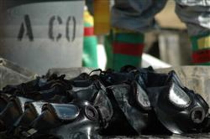 M-40 field protective masks dry in the sun after being decontaminated by Decontamination Team, Company A, Chemical Biological Incident Response Force, II Marine Expeditionary Force, following a live chemical-warfare agent training evolution, Sept. 13. All personal protective equipment, including the mask, is required to be thoroughly decontaminated to avoid cross-contamination.