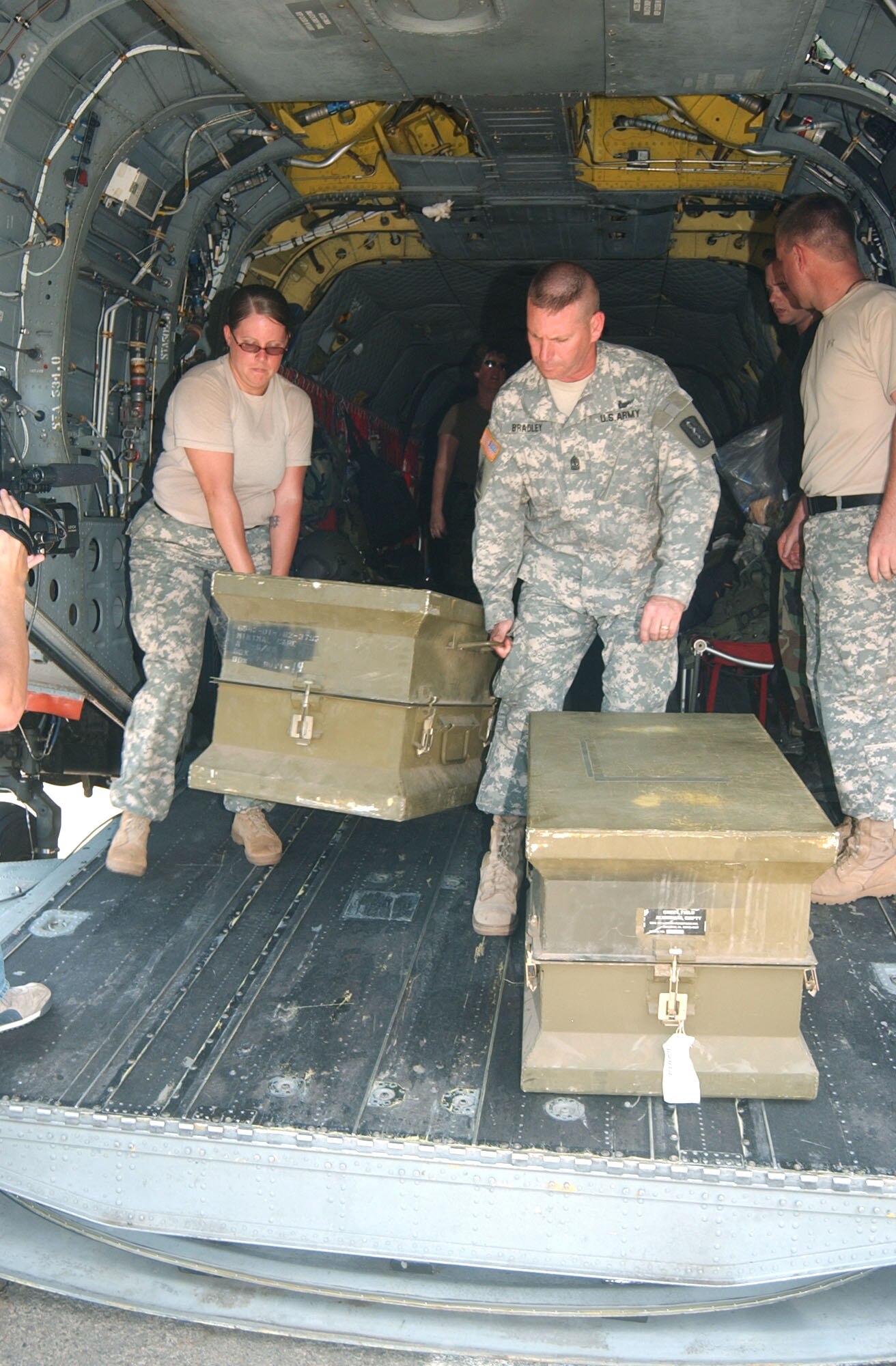 Army Sgt. Bonnie Blevins and Army Master Sgt. John Bradley unload a trunk filled with medical equipment, which was donated to a hospital in Leon, Nicaragua, Sept. 13. Joint Task Force-Bravo members at Soto Cano Air Base, Honduras, donated more than $185,000 worth of medical equipment and supplies to a hospital where people were being treated after an alcohol poisoning epidemic claimed the lives of more than 45 people and left hundreds more ill. (U.S. Air Force photo/Capt. Alysia Harvey) 

