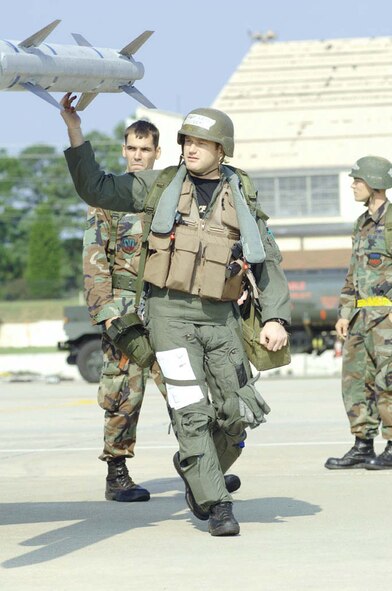 Capt. Josh King, 79th Fighter Squadron, pre-flights an F-16 during the exercise. (U.S. Air Force Photo/Airman Matthew Davis.)