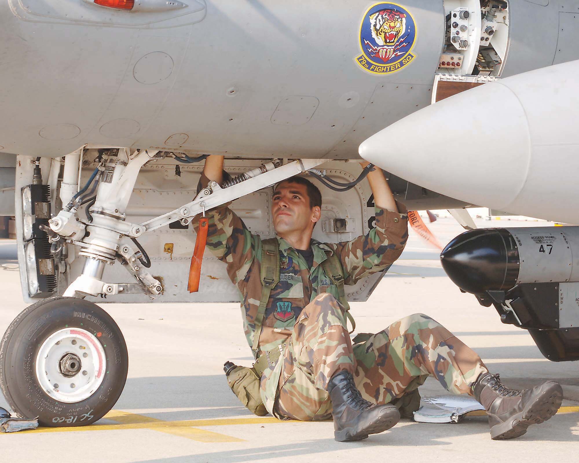 Senior Airman Jeremy Houser, 79th Aircraft Maintenance Unit, conducts a through flight inspection Tuesday as part of Shaw's Phase II operational readiness exercise. (U.S. Air Force photo/Airman Matthew Davis)