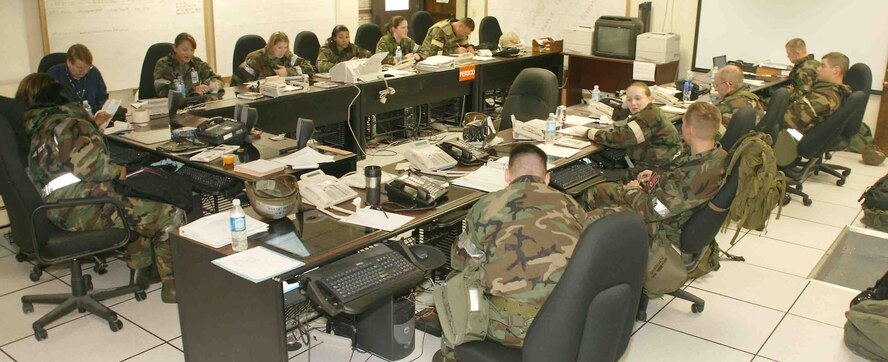 Base unit reps are centrally located to maximize communication during the exercise. (U.S. Air Force photo/Senior Airman John Gordinier)