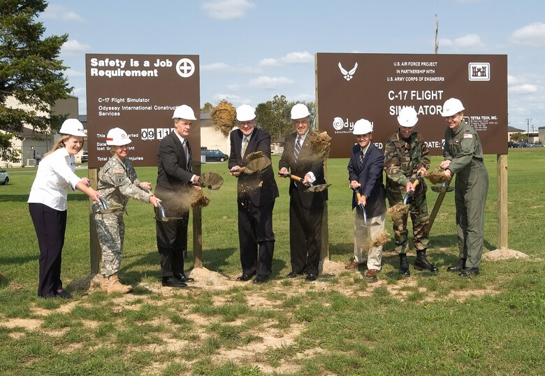 (Left to right) Ms. Whitney McBride, president of Odyssey Construction; Lt. Col. Gwen Baker, U.S. Army Corps of Engineers Philadelphia District commander; Sen. Thomas Carper; U.S. Rep. Mike Castle; Sen. Joseph Biden; Dover Mayor Stephen Speed; Col. Sam Cox, 436th AW commander; and Col. David Wuest, 512th AW vice commander, break ground at the site of the future C-17 Aircrew Training Facility here Monday. (U.S. Air Force photo/Jason Minto)