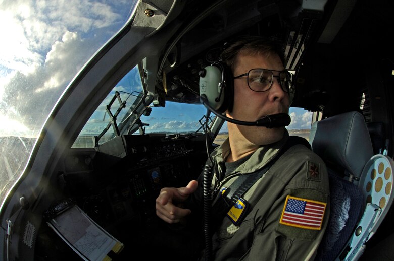 Maj. Joseph Golovach conducts last-minute checks before taking off from Wake Island Sept. 12. The C-17 is taking the 36th Contingency Response Group back home to Andersen Air Force Base, Guam. The 36th CRG was the initial assessment team on the island to survey the damage after the island was hit by Super Typhoon Ioke Aug. 31. Major Golovach is from the 535th Airlift Squadron at Hickam Air Force Base, Hawaii. (U.S. Air Force photo/Tech. Sgt. Shane A. Cuomo) 
