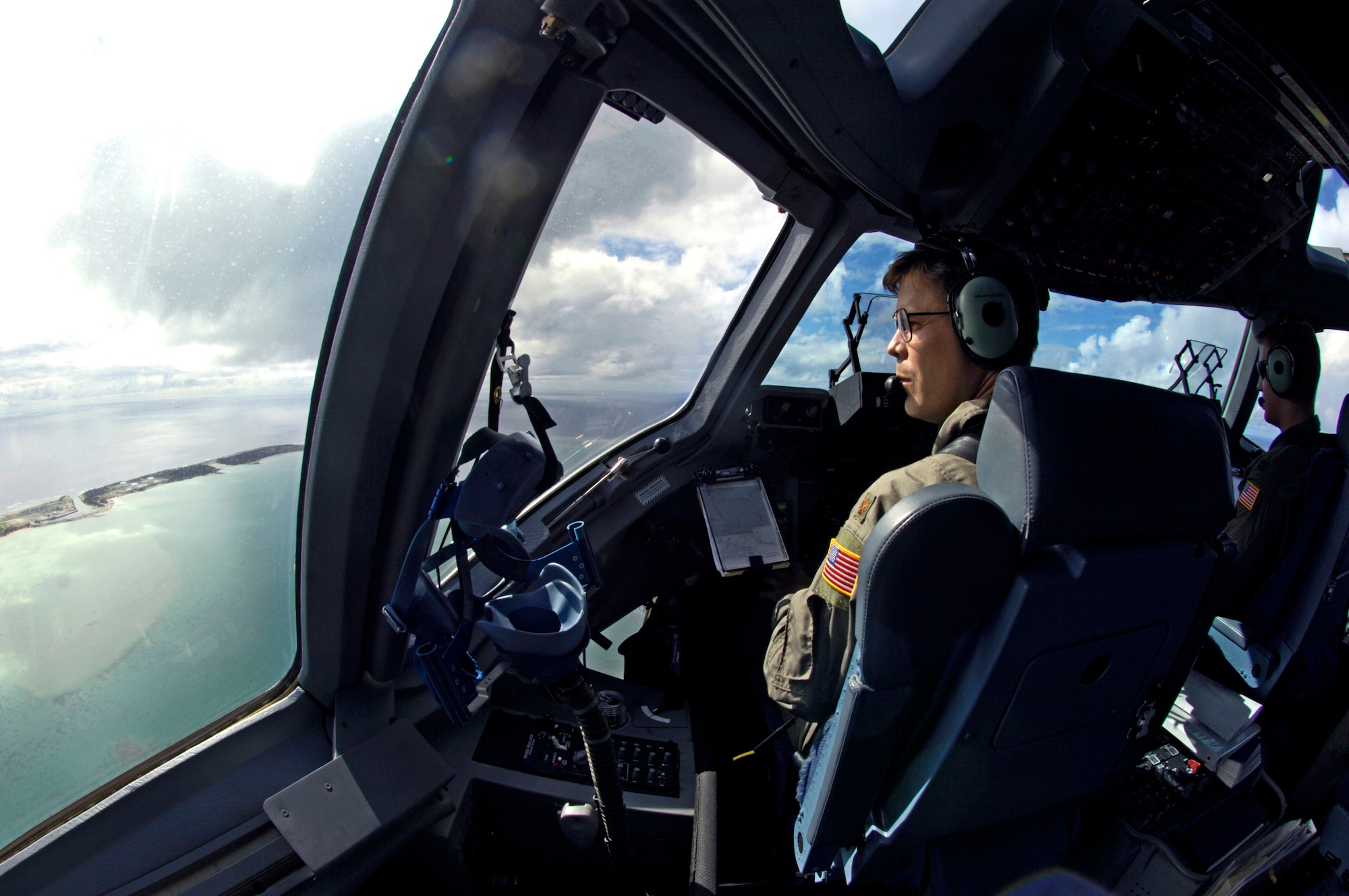 Maj. Joseph Golovach checks out the runway during a flyby of Wake Island before landing Sept. 12. The C-17 brought a 53-person team to assess damage left by Super Typhoon Ioke after it struck the island Aug. 31. Major Golovach is a pilot from the 535th Airlift Squadron at Hickam Air Force Base, Hawaii. (U.S. Air Force photo/Tech. Sgt. Shane A. Cuomo)