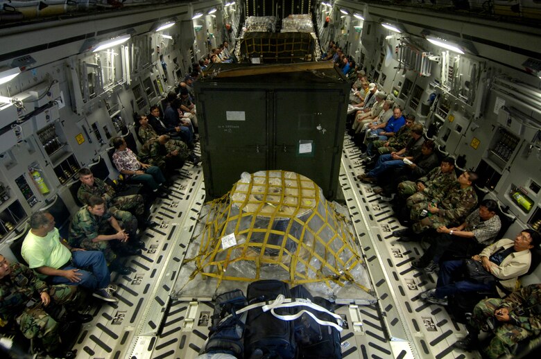 A 53-person assessment team and their cargo are loaded on a C-17 Globemaster III at Hickam Air Force Base, Hawaii, Sept. 12. The C-17, from the 535th Airlift Squadron, took a team comprised of civil engineers, Defense Department employees and contractor to Wake Island to assess the damage left by Super Typhoon Ioke that hit the island Aug. 31. (U.S. Air Force photo/Tech. Sgt. Shane A. Cuomo) 
