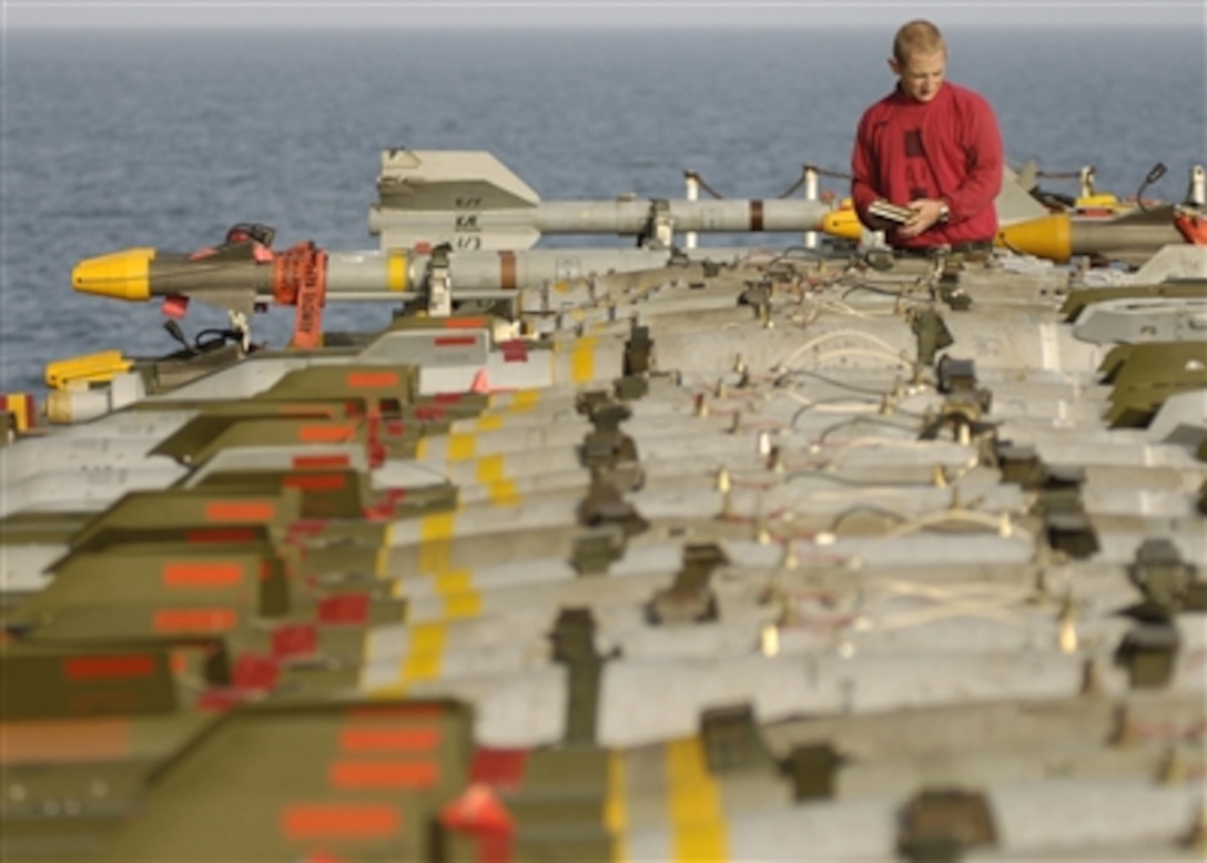 U.S. Navy Petty Officer 3rd Class Tristan Rose inspects ordnance on the flight deck of the nuclear-powered aircraft carrier USS Enterprise (CVN 65) on Sept. 13, 2006. Enterprise and embarked Carrier Air Wing 1 are on a six-month deployment in the Arabian Sea.  Rose is a Navy aviation ordnanceman.  