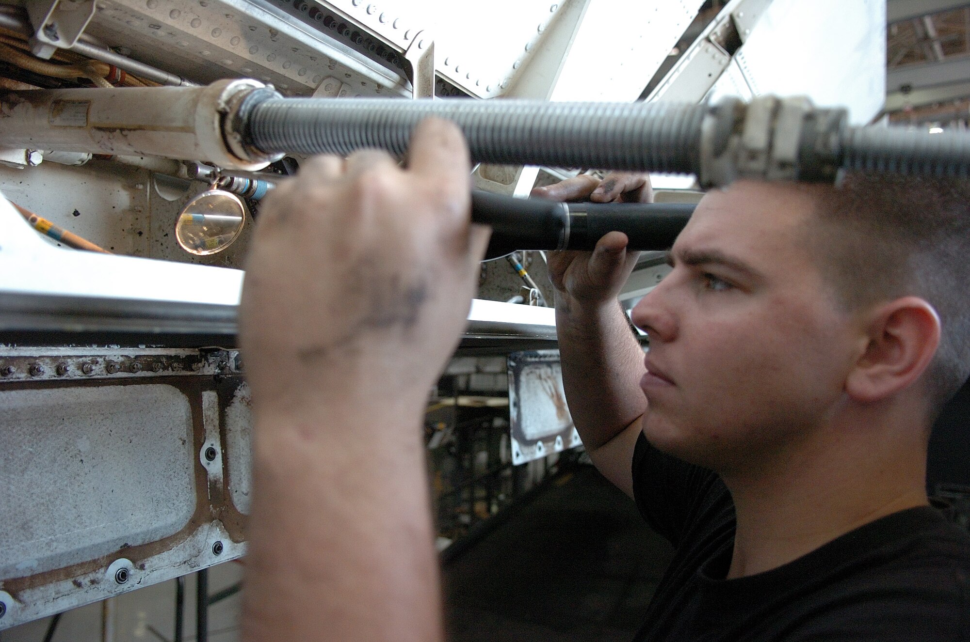 Airman 1st Class Aaron Gill checks for foreign objects while performing a preventative maintenance inspection Sept. 13 on a B-1 Lancer at Dyess Air Force Base, Texas. An inspection on the bomber is required after every 600 hours of flying time. Airman Gill is a member of the 9th Bomb Squadron. (U.S. Air Force photo/Tech. Sgt. Larry A. Simmons)