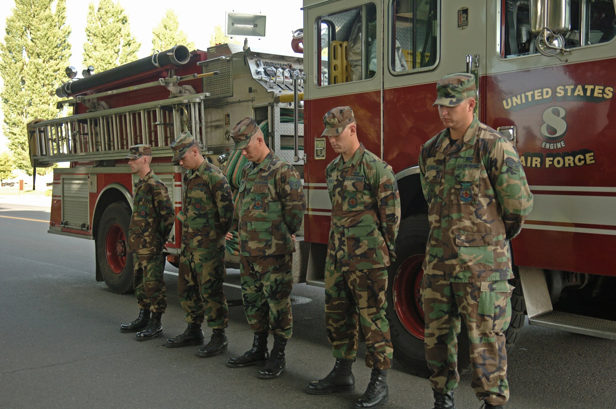 Airmen from the Fairchild fire department observe a moment of silence.  (U.S. Air Force photo/Senior Airman Jessica Fuentez)