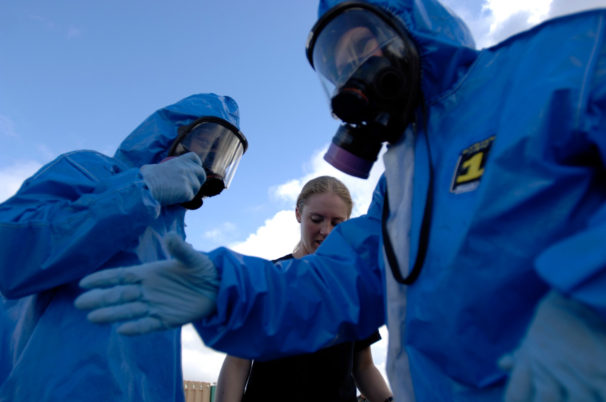 Tech. Sgt. Melanie Berry and Capt. Isaiah Manigault prepare to inspect a simulated ambulance crash scenario at the Chemical Biological Radiological Nuclear Challenge at Brooks City-Base, San Antonio, Sept. 15. The Airmen are participants from Air Mobility Command. (U.S. Air Force photo/Tech. Sgt. Cecilio M. Ricardo Jr.)

