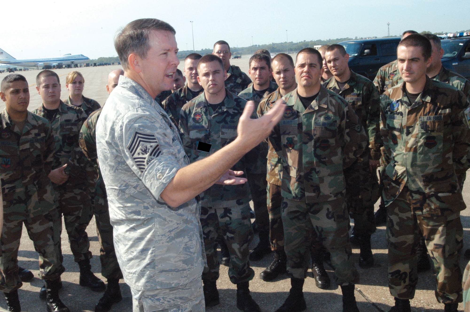 Chief Master Sgt. of the Air Force Rodney J. McKinley speaks to Offutt Airmen on the flightline at Lincoln Airpark, Neb., Sept. 8. The airpark is the 55th Wing's "home away from home" while Offutt undergoes runway repairs. (U.S. Air Force photo illustration)