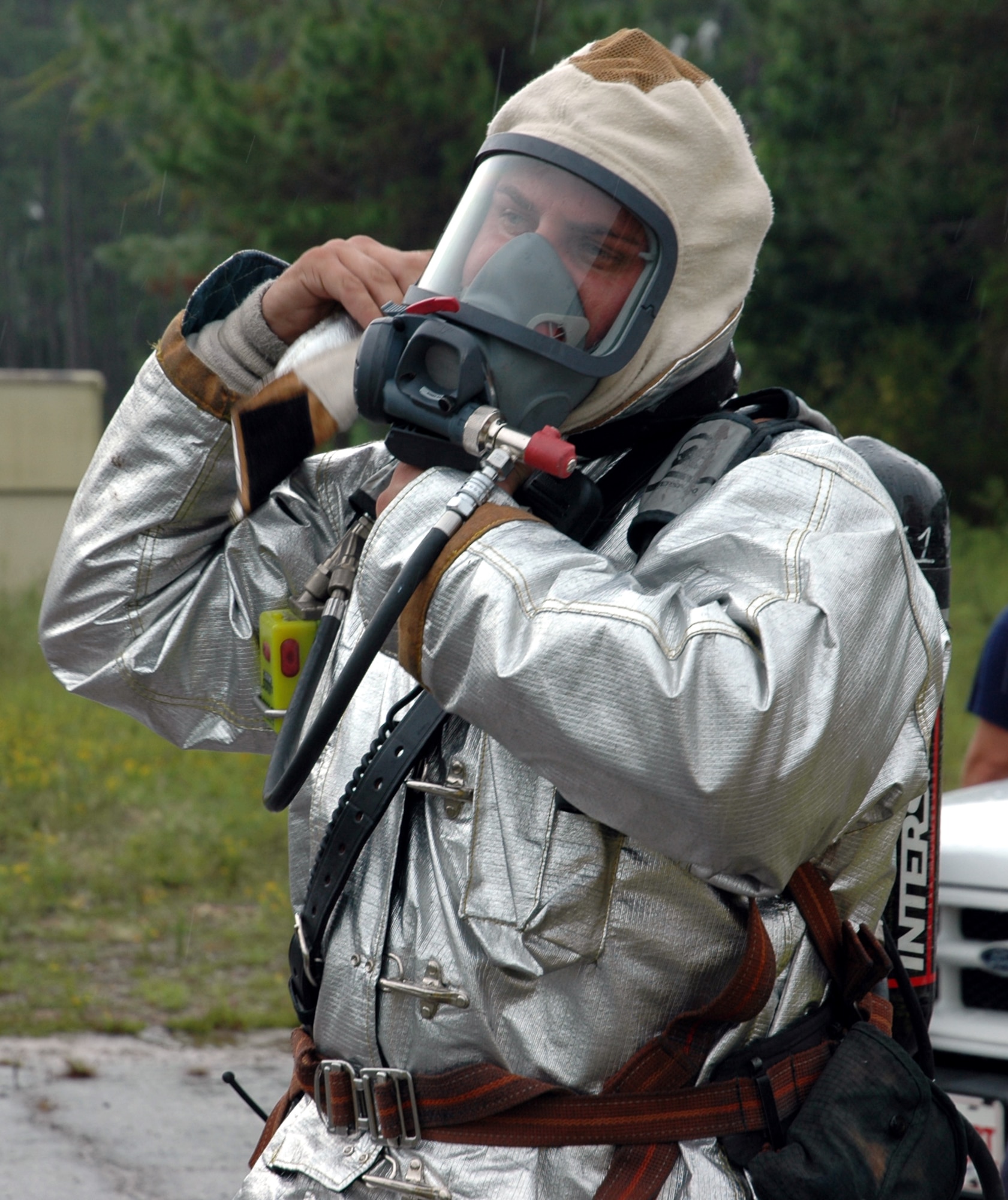 Tech. Sgt. Jeff Roberts, 16th Civil Engineer Squadron, Fire and Emergency Services Flight, dons his fire suit before a vehicle fire training session Monday morning.
(U.S. Air Force Photograph by Jamie Haig)