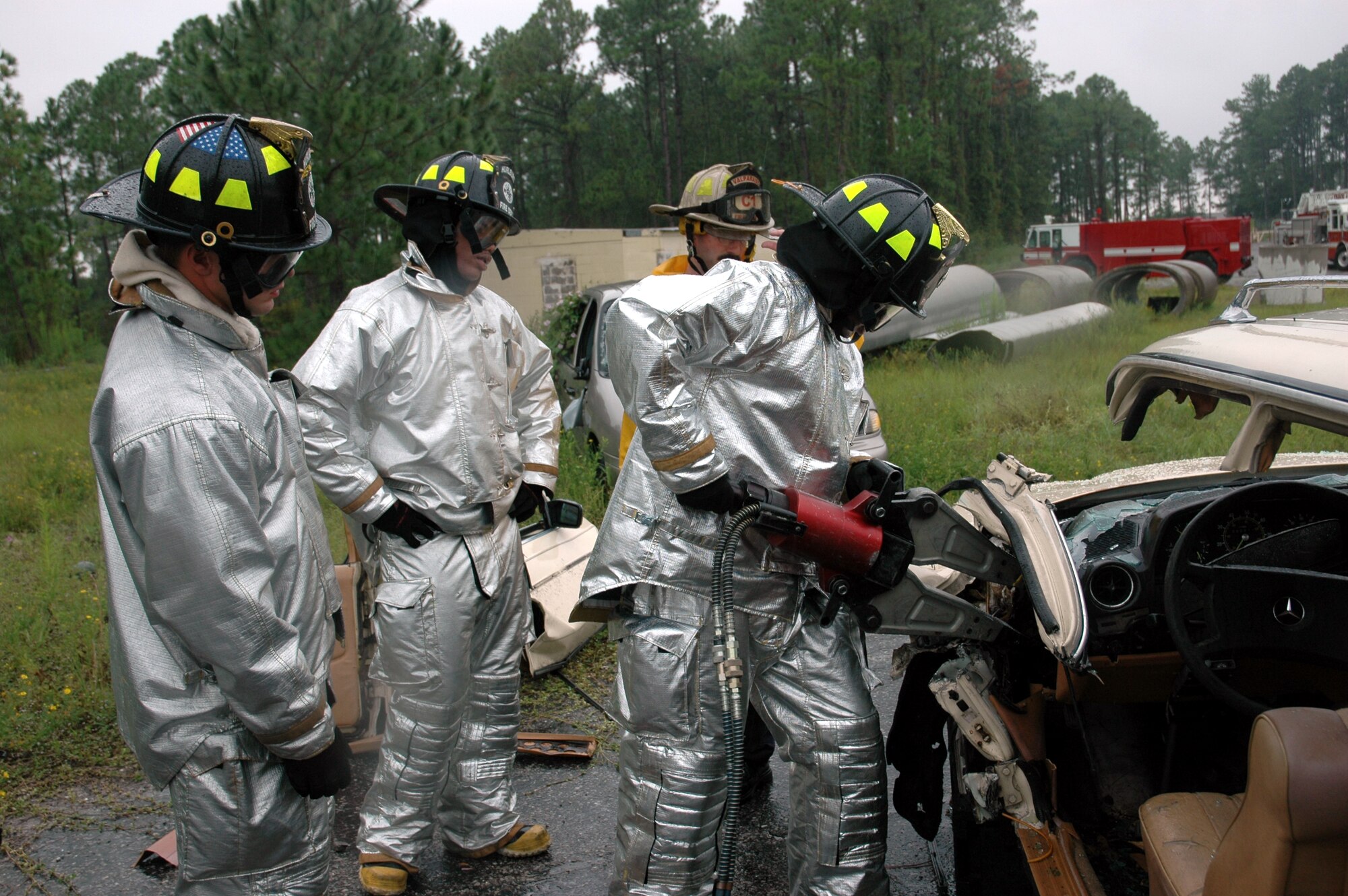 Hurlburt Field firefighters practice operating the “Jaws of Life” during a training session Monday here. (U.S. Air Force Photograph by Jamie Haig)



