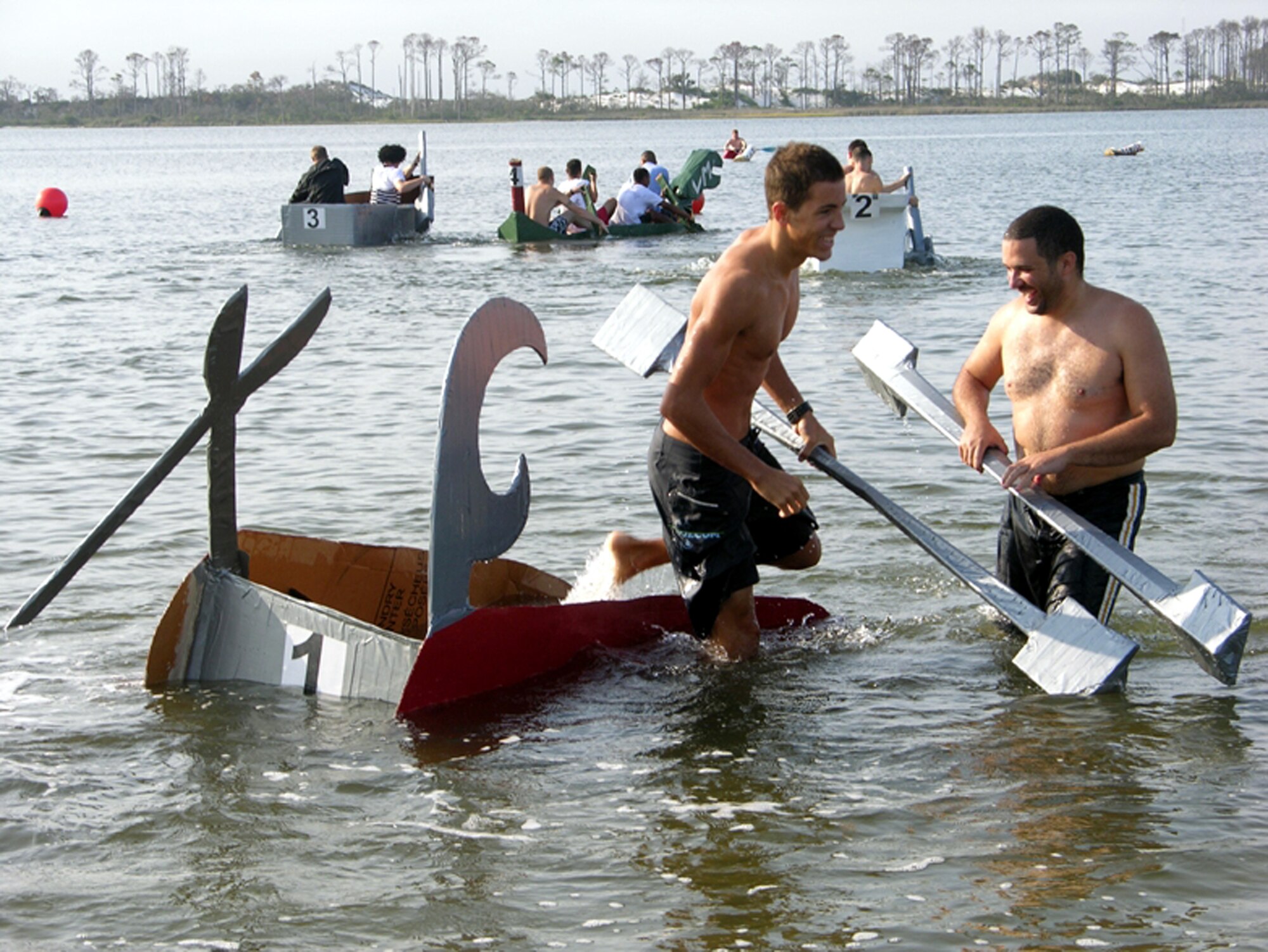 The Swiss Knife heads to the bottom of the sound and wins the Davey Jones Locker (first to sink) award during the annual H2Olympics held here Sept. 8 at Outdoor Recreation. (U.S. Air Force Photograph by Jamie Haig)