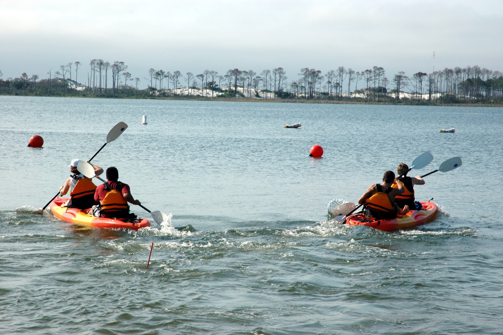 Airmen participating in the kayak race head for the turn during the competition. (U.S. Air Force Photograph by Jamie Haig)