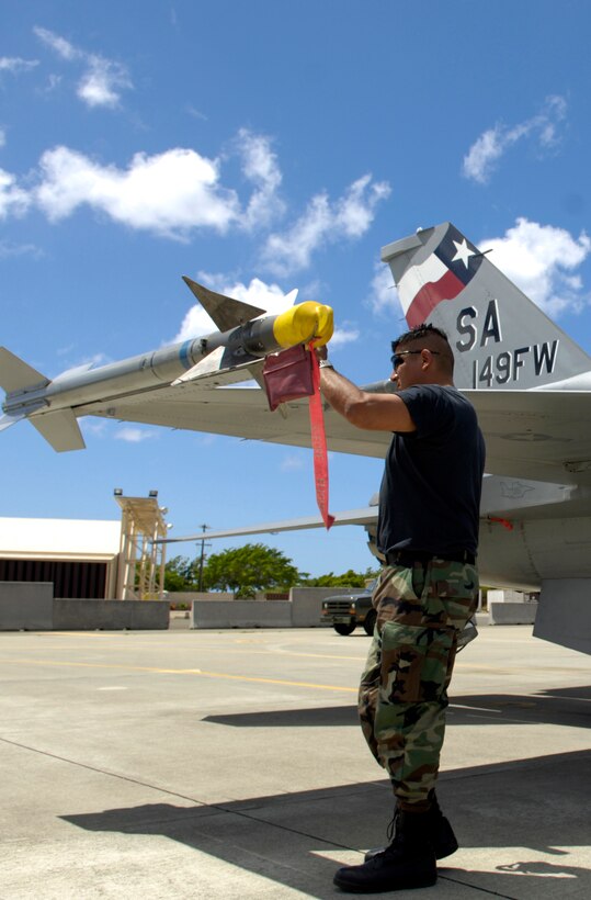 Master Sgt. Carlos Rodriguez conducts a post flight inspection on his F-16 Fighting Falcon at Hickam Air Force Base, Hawaii Sept. 8, 2006 during Exercise Sentry Aloha. MSgt Rodriguez is a crew chief with the Texas Air National Guard’s 149th Fighter Wing. The exercise brings dissimilar combat assets to Hickam to train with the Hawaii Air National Guard’s 199th Fighter Squadron. (U.S. Air Force photo/ Tech. Sgt. Shane A. Cuomo)