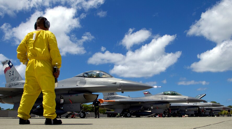 Tech. Sgt. Gerardo Guevara waits for his F-16 Fighting Falcons to shut down their engines before conducting his post flight checks at Hickam Air Force Base, Hawaii Sept. 8, 2006. Six F-16s from the Texas Air National Guard 149th Fighter Wing came to Hickam to participate in Exercise Sentry Aloha. The exercise brings dissimilar combat assets to Hickam to train with the Hawaii Air National Guard’s 199th Fighter Squadron. (U.S. Air Force photo/ Tech. Sgt. Shane A. Cuomo)