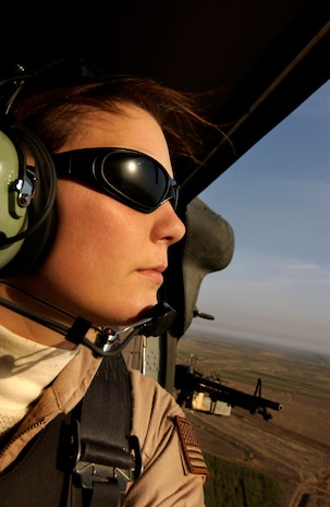 Staff Sgt. Stacy Pearsall, 1st Combat Camera Squadron aerial combat photojournalist, is featured on the cover of Pink magazine's October issue. (U. S. Air Force Photo/Staff Sgt. Stacy Pearsall)