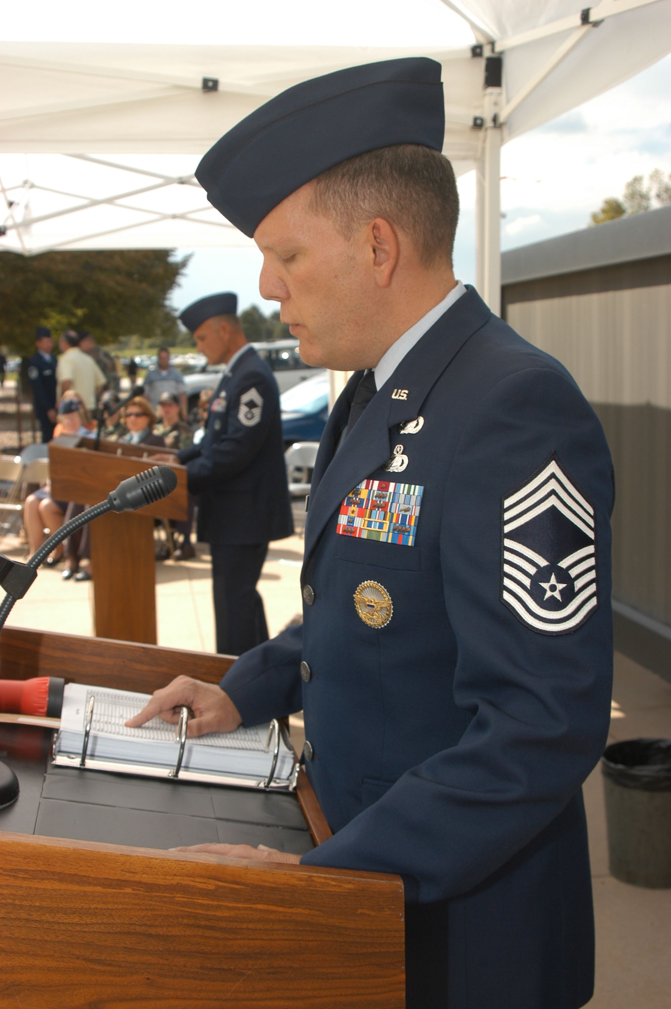 Chief Master Sgt. Arthur Engelbrecht reads the names of servicemembers missing or taken prisoner at a Prisoner of War and Missing in Action remembrance ceremony in Denver Sept. 14. The reading of names continues from 3 p.m. Sept. 14 through 3 p.m. Sept. 15, and is an annual ceremony in honor of National POW/MIA Recognition Day. Chief Engelbrecht is assigned to Air Reserve Personnel Center. (DOD photo/Cheresa D. Theiral)
