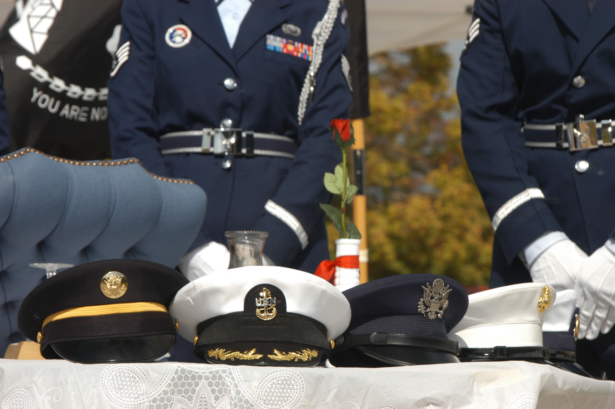 The hats of each branch of the United States armed forces sit atop the POW/MIA table during a Prisoner of War and Missing in Action remembrance ceremony in Denver Sept. 14. The ceremony is part of a 24-hour vigil marking National POW/MIA Recognition Day. (DOD photo/Cheresa D. Theiral)
