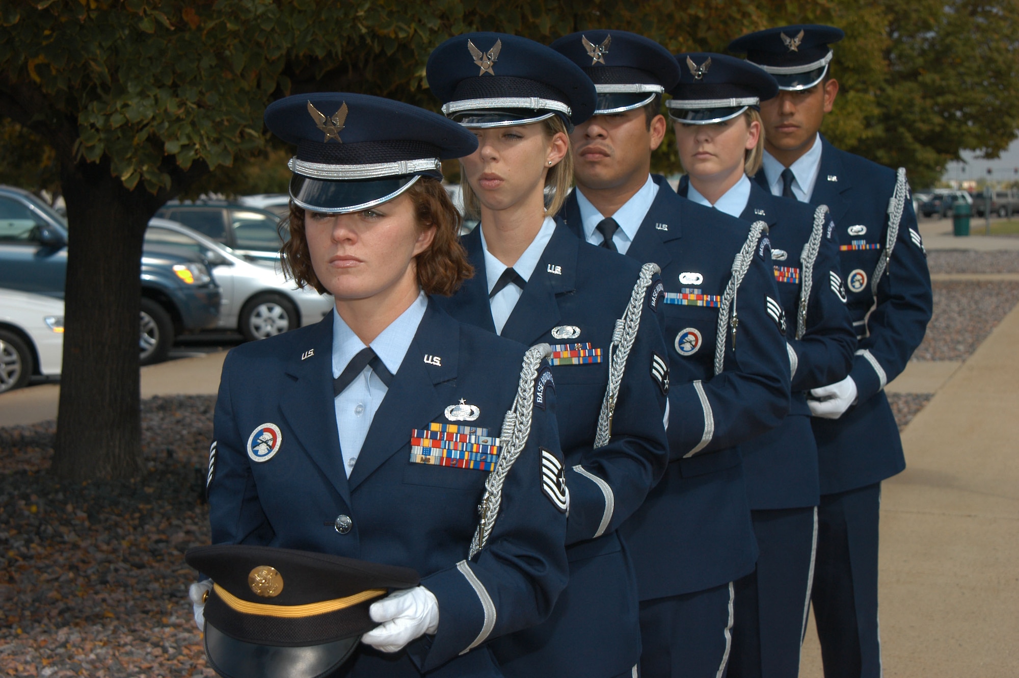 Members of the Air Reserve Personnel Center and Defense Finance and Accounting Service honor guard wait to place service hats on the POW/MIA table during a Prisoner of War and Missing in Action remembrance ceremony in Denver Sept. 14. Military and civilian employees of ARPC, Defense Finance and Accounting Service and the 4th Manpower Requirements Squadron are reading the names of more than 10,000 people missing or taken prisoner from the Cold War through current operations. The ceremony runs from 3 p.m. Sept. 14 through 3 p.m. Sept. 15. (DOD photo/Cheresa D. Theiral)
