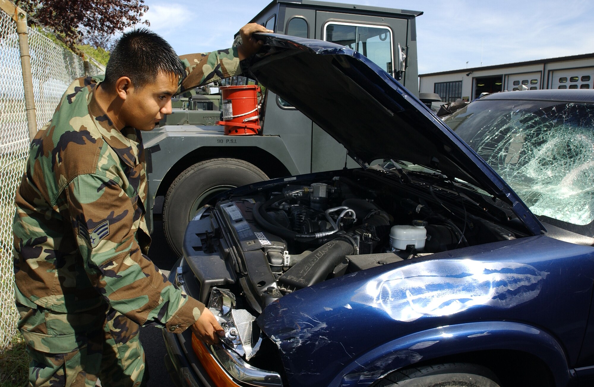 Senior Airman Octavio Ortega, 31st Logistics Readiness Squadron vehicle maintenance customer service representative, works on a damaged government owned vehicle Sept. 6.