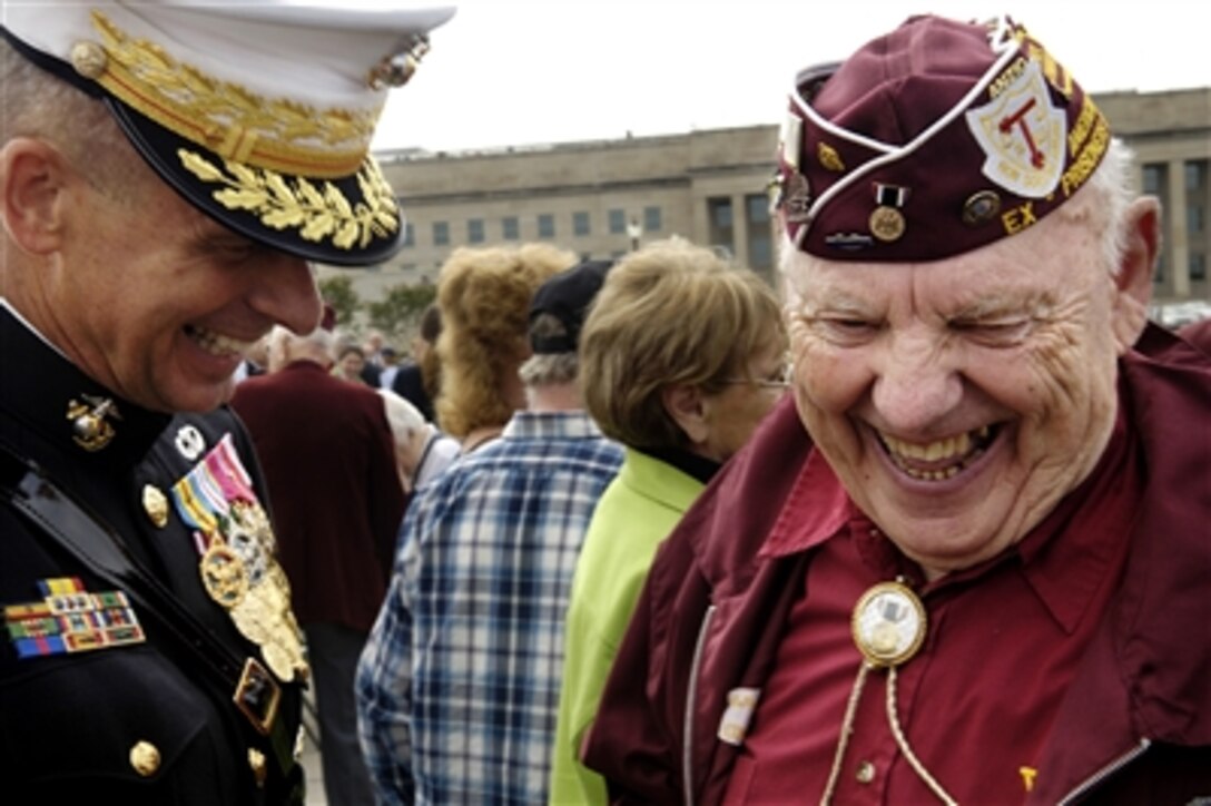 American ex prisoner of war John Meyers laughs as he shares a war story with Chairman of the Joint Chiefs of Staff U.S. Marine Corps Gen. Peter Pace following a ceremony in honor of National POW/MIA Recognition Day at the Pentagon, Sept. 15, 2006.  Deputy Secretary of Defense Gordon England co-hosted the event and Connecticutt Congressman Robert Simmons was the guest speaker at the event.