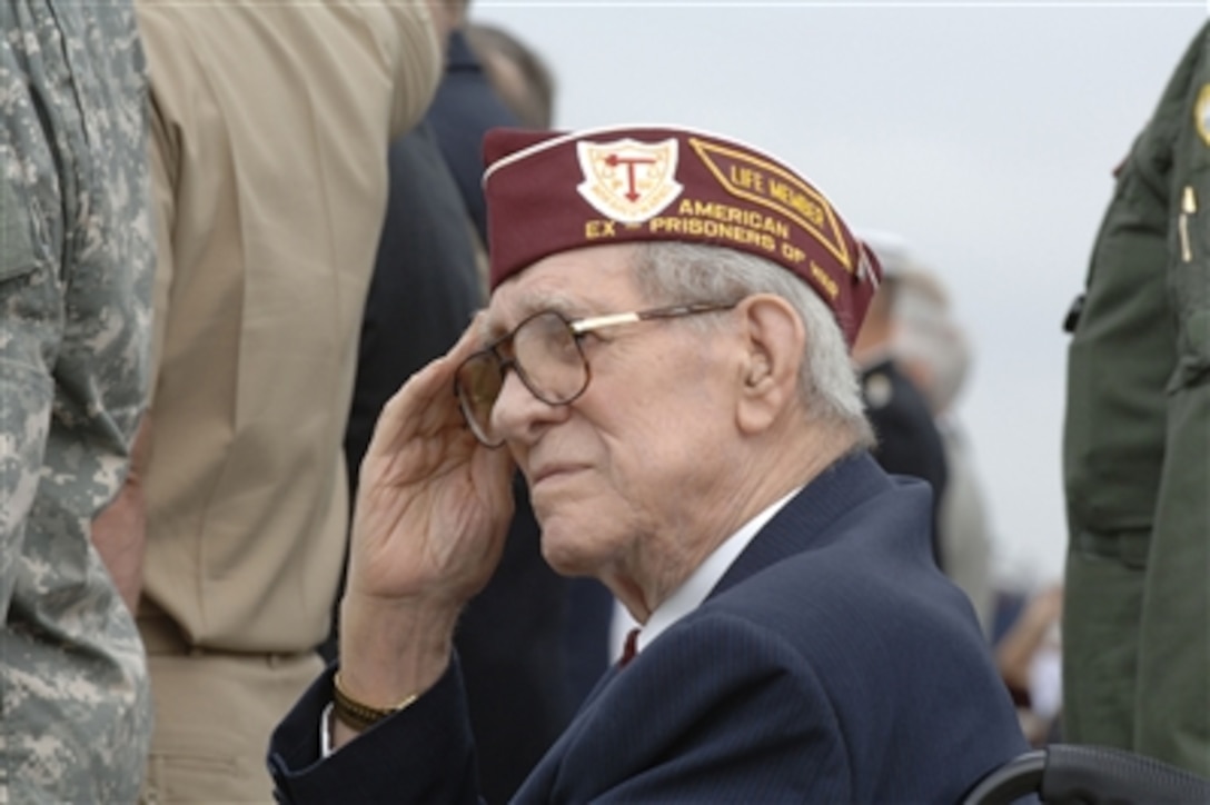 An ex-prisoner of war salutes during the playing of the National Anthem at the POW/MIA Recognition Day ceremonies at the Pentagon on Sept. 15, 2006.  Congressman and Vietnam veteran Robert Simmons was the guest speaker at the ceremony hosted by Deputy Secretary of Defense Gordon England and Chairman Joint Chiefs of Staff Gen. Peter Pace, U.S. Marine Corps.  