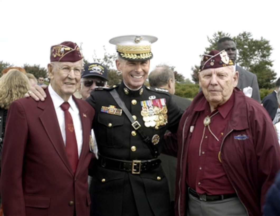 Chairman Joint Chiefs of Staff Gen. Peter Pace, U.S. Marine Corps, is pleased to pose for a photo with two World War II veterans after the POW/MIA Recognition Day ceremonies at the Pentagon on Sept. 15, 2006.  Congressman and Vietnam veteran Robert Simmons was the guest speaker at the ceremony hosted by Deputy Secretary of Defense Gordon England and Pace.  