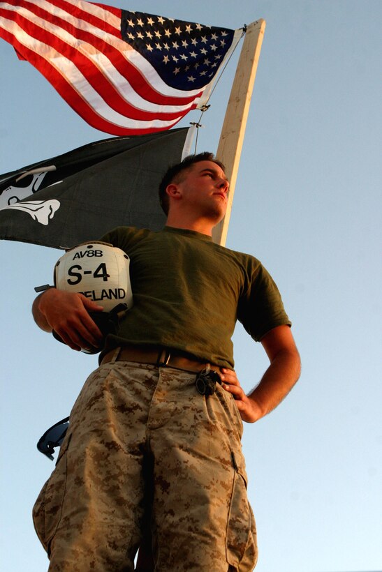 Cpl. Joshua Copeland, a 21-year-old AV-8B Harrier embarker, watches over an airfield in Kandahar, Afghanistan, on Sept. 15.  The Green Bay, Wis., native was inspired to join the Marine Corps after a friend, Pfc. Ryan Jerabek, died in Fallujah, Iraq. Copeland, along with 19 other Marines and Sailors from the 24th Marine Expeditionary Unit (Special Operations Capable), spent 10 days in September supporting air operations over the skies of Afghanistan as part of Operation Enduring Freedom.