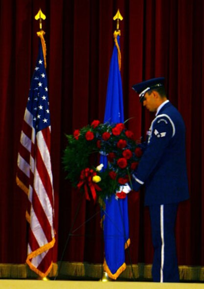 A member of the Total Force Blue Eagles Honor Guard lays a wreath during the base's annual POW/MIA remembrance ceremony on Friday, September 15, 2006 at March Air Reserve Base.  Veterans' groups, local dignitaries and installation members attended the event.  (U.S. Air Force photo by Staff Sgt. Amy Abbott, 452 AMW/Public Affairs)