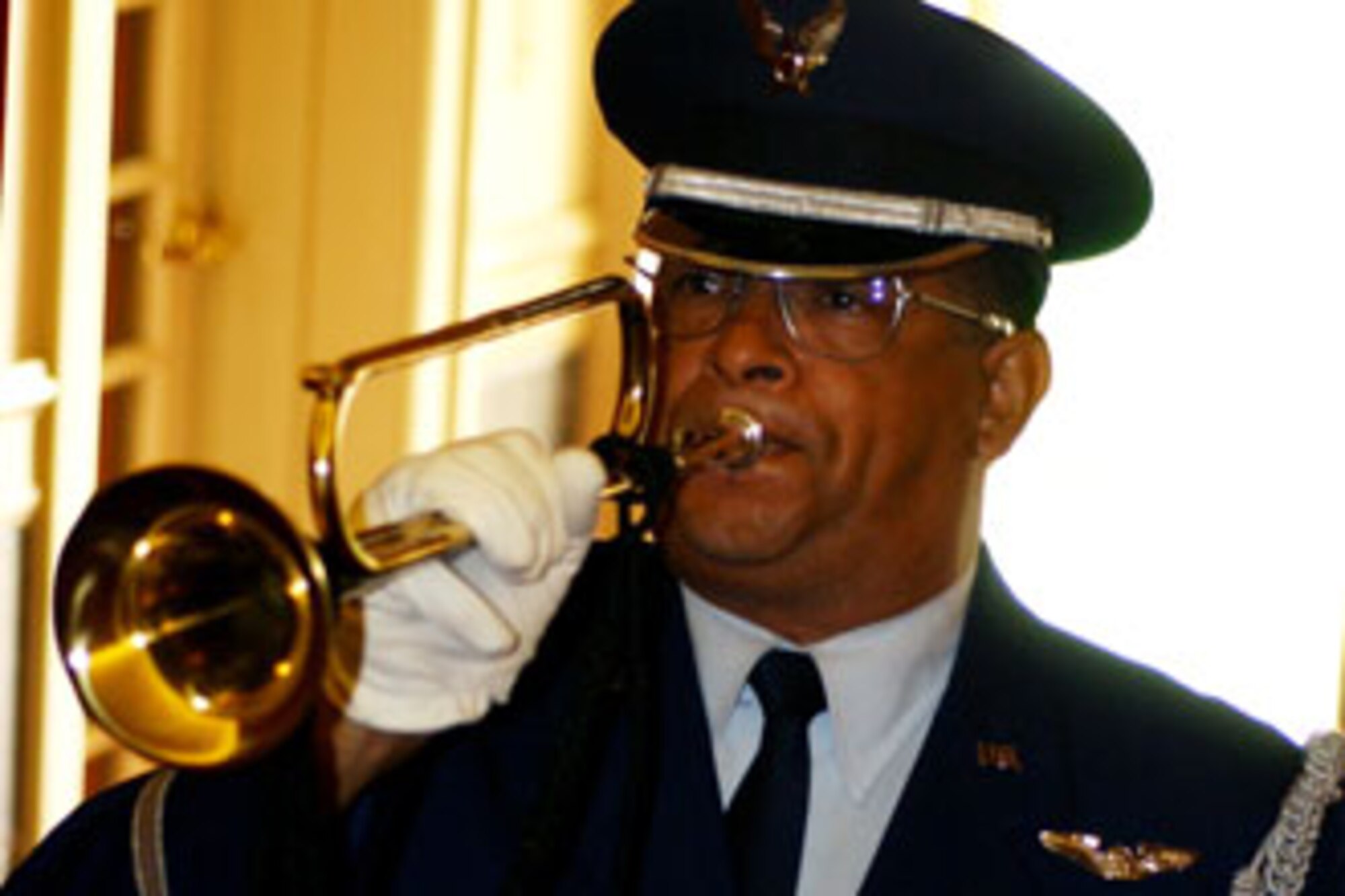 Master Sgt. Robert Carreon plays taps on his bugle during the base's annual POW/MIA remembrance ceremony on Friday, September 15, 2006 at March Air Reserve Base.  Veterans' groups, local dignitaries and installation members attended the event.  (U.S. Air Force photo by Staff Sgt. Amy Abbott, 452 AMW/Public Affairs)