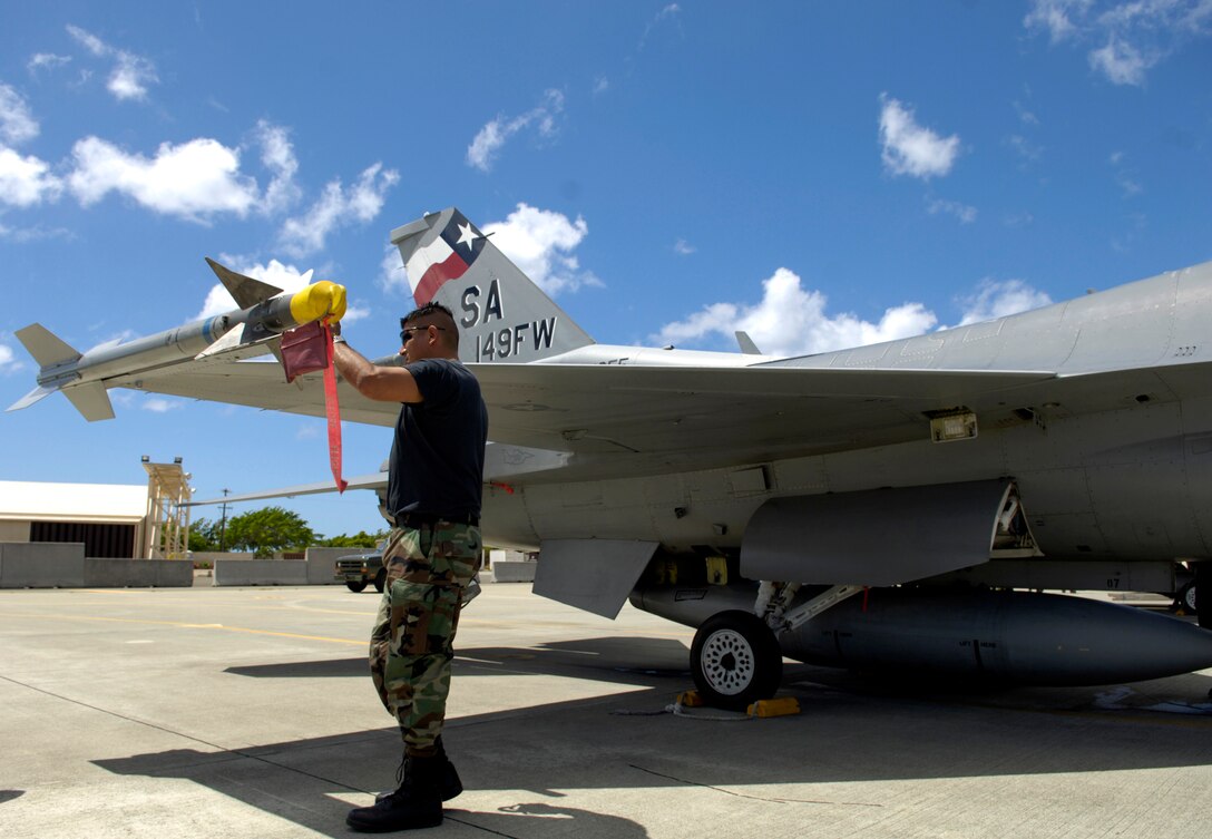 Master Sgt. Carlos Rodriguez conducts a post-flight inspection on an F-16 Fighting Falcon at Hickam Air Force Base, Hawaii, Sept. 8 during Exercise Sentry Aloha. Sergeant Rodriguez is a crew chief with the Texas Air National Guard's 149th Fighter Wing. (U.S. Air Force photo/Tech. Sgt. Shane A. Cuomo) 