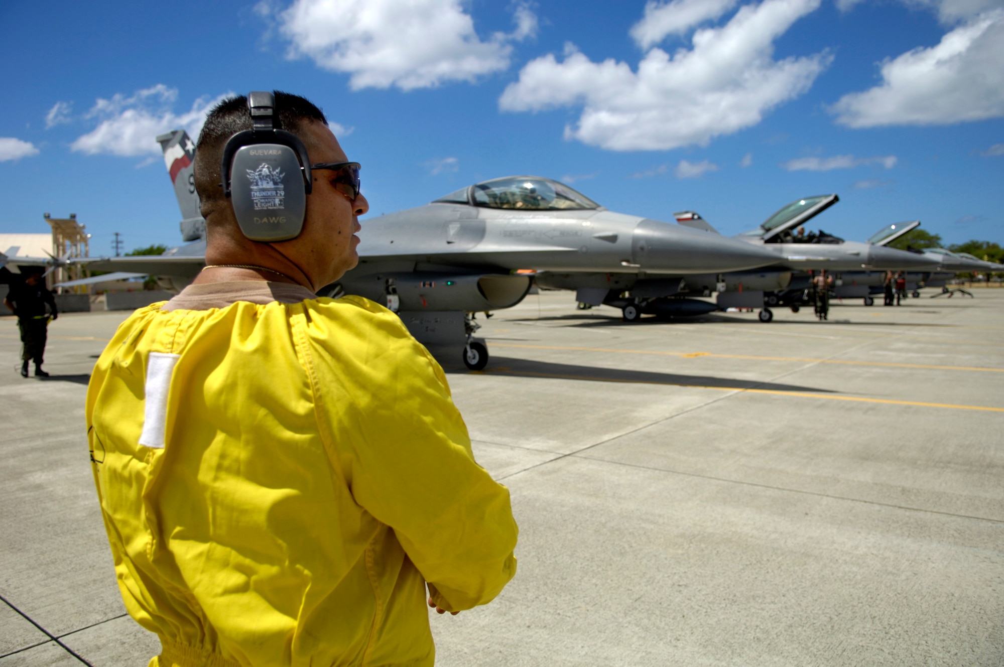 Tech. Sgt. Gerardo Guevara waits for the F-16 Fighting Falcons to shut down their engines before conducting his post-flight checks at Hickam Air Force Base, Hawaii, Sept. 8. Six F-16s from the Texas Air National Guard's 149th Fighter Wing came to Hickam to participate in Exercise Sentry Aloha. Sergeant Guevara is a maintainer from the 149th FW. (U.S. Air Force photo/Tech. Sgt. Shane A. Cuomo) 