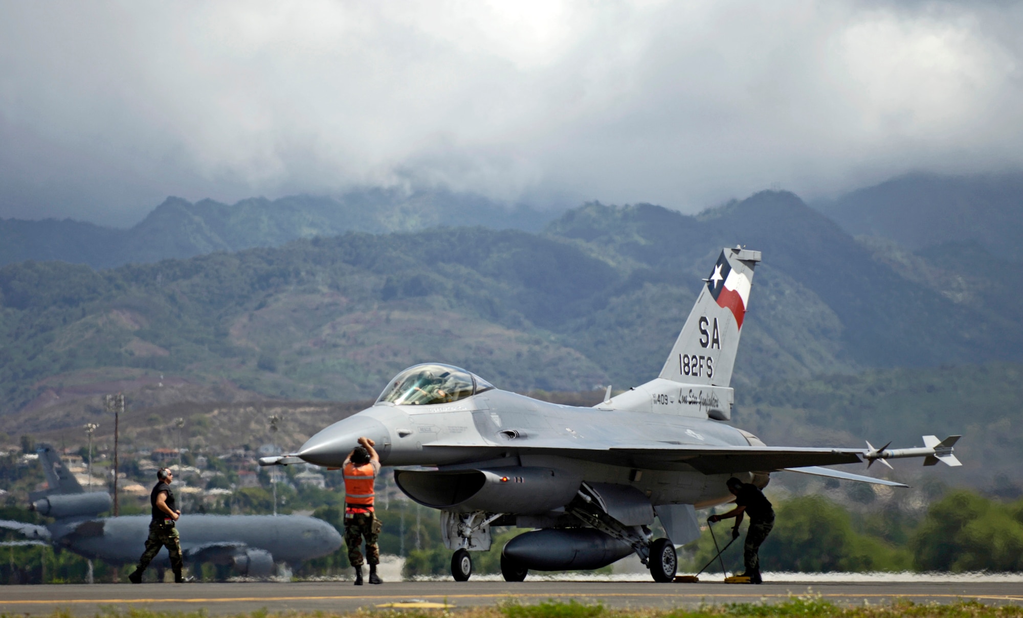 Maintenance crew members recover their F-16 Fighting Falcon after it returns to Hickam Air Force Base, Hawaii, from an air-to-air mission Sept. 8 during Exercise Sentry Aloha. The maintenance crew are from the Texas Air National Guard's 149th Fighter Wing. (U.S. Air Force photo/ Tech. Sgt. Shane A. Cuomo)