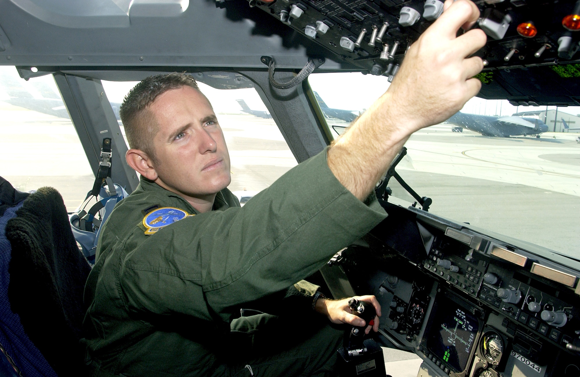 Capt. Carl Miller performs a preflight inspection in the cockpit of a C-17 Globemaster III Sept. 18. Captain Miller is a pilot with the 14th Airlift Squadron at Charleston Air Force Base, S.C. (U.S. Air Force photo/Airman 1st Class Sam Hymas) 
