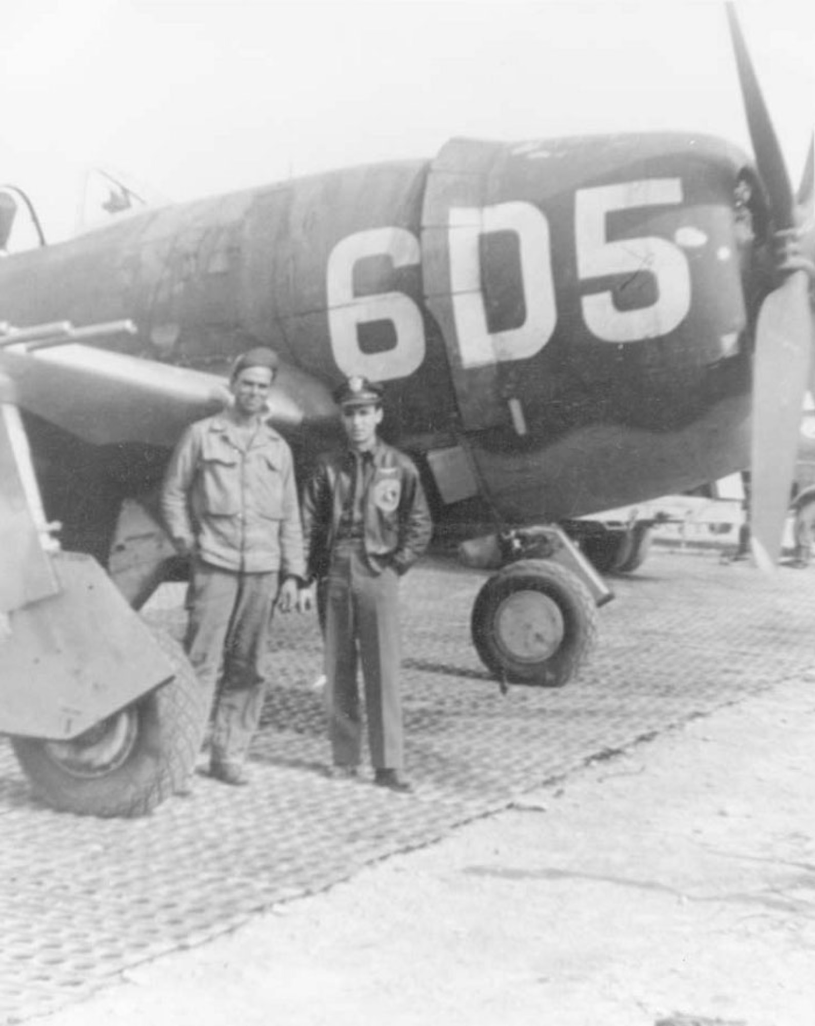 1Lt. Raymond L. Knight with his crew chief, Sgt. Marvin Childers. The aircraft pictured is the one Lt. Knight flew on his Medal of Honor mission in April 1945. (U.S. Air Force photo)