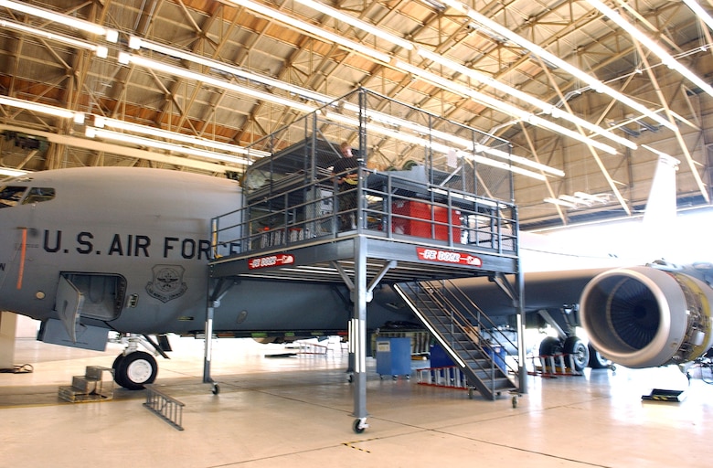 Staff Sgt. Chris Moore inspects a refueling boom fairing using the cargo door platform work station, an Air Force Smart Operations 21 initiative, at Fairchild Air Force Base, Wash., Sept. 12. Sergeant Moore is a floor supervisor with the 92nd Maintenance Squadron's Periodic Inspection Element. (U.S. Air Force photo/Joe B. Wiles)