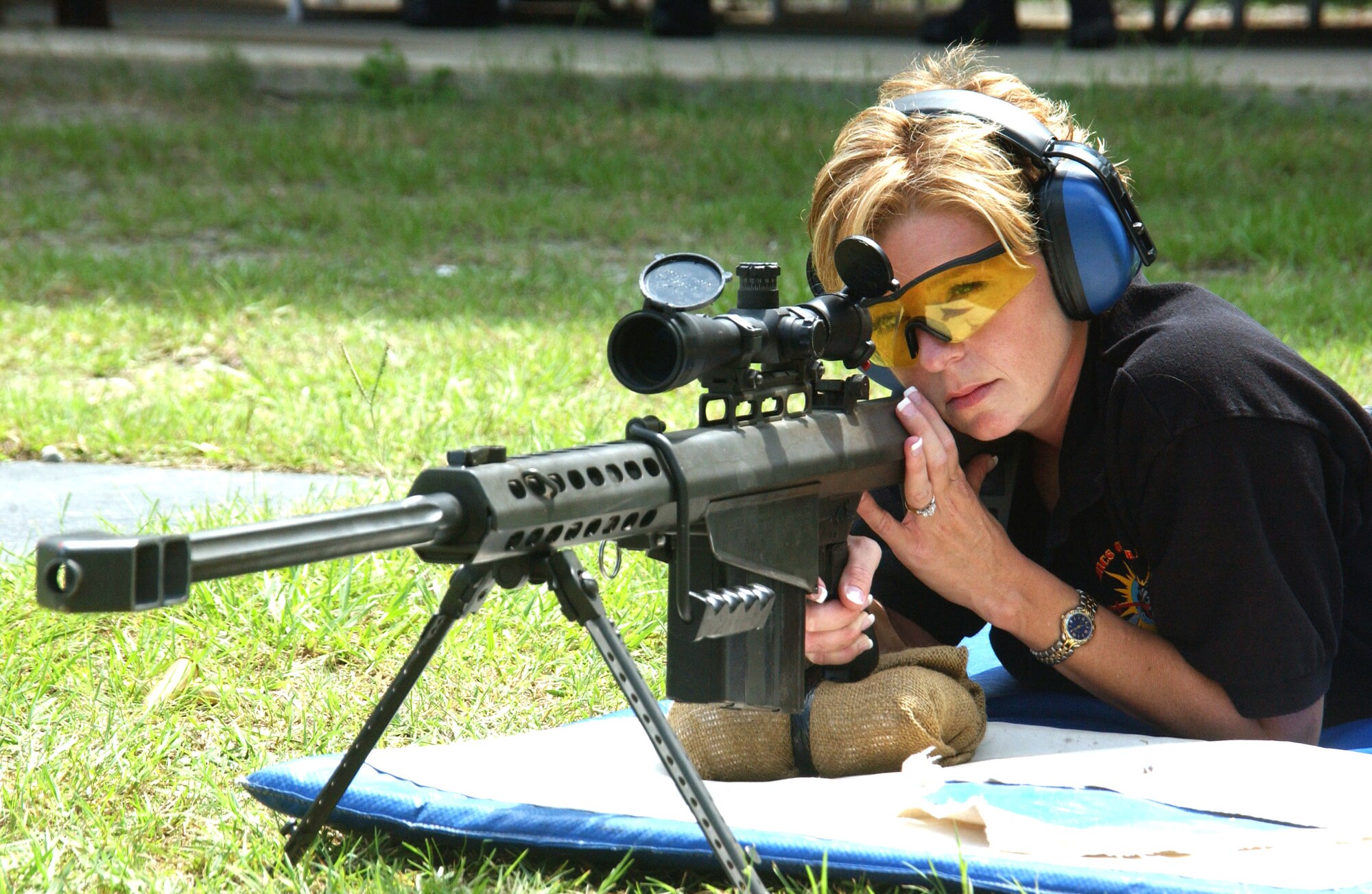 Master Sgt. Tanya Breed sights in a Barrett .50 caliber sniper rifle during training at Hurlburt Field, Fla., Sept. 13. Sergeant Breed demonstrated sniper capabilities for students at the U.S. Air Force Special Operations School's Dynamics of International Terrorism course, which offers students a basic awareness of the motivation, capabilities and threat posed by terrorist groups. Sergeant Breed is superintendent of operations at the school. (U.S. Air Force photo/Chief Master Sgt. Gary Emery)