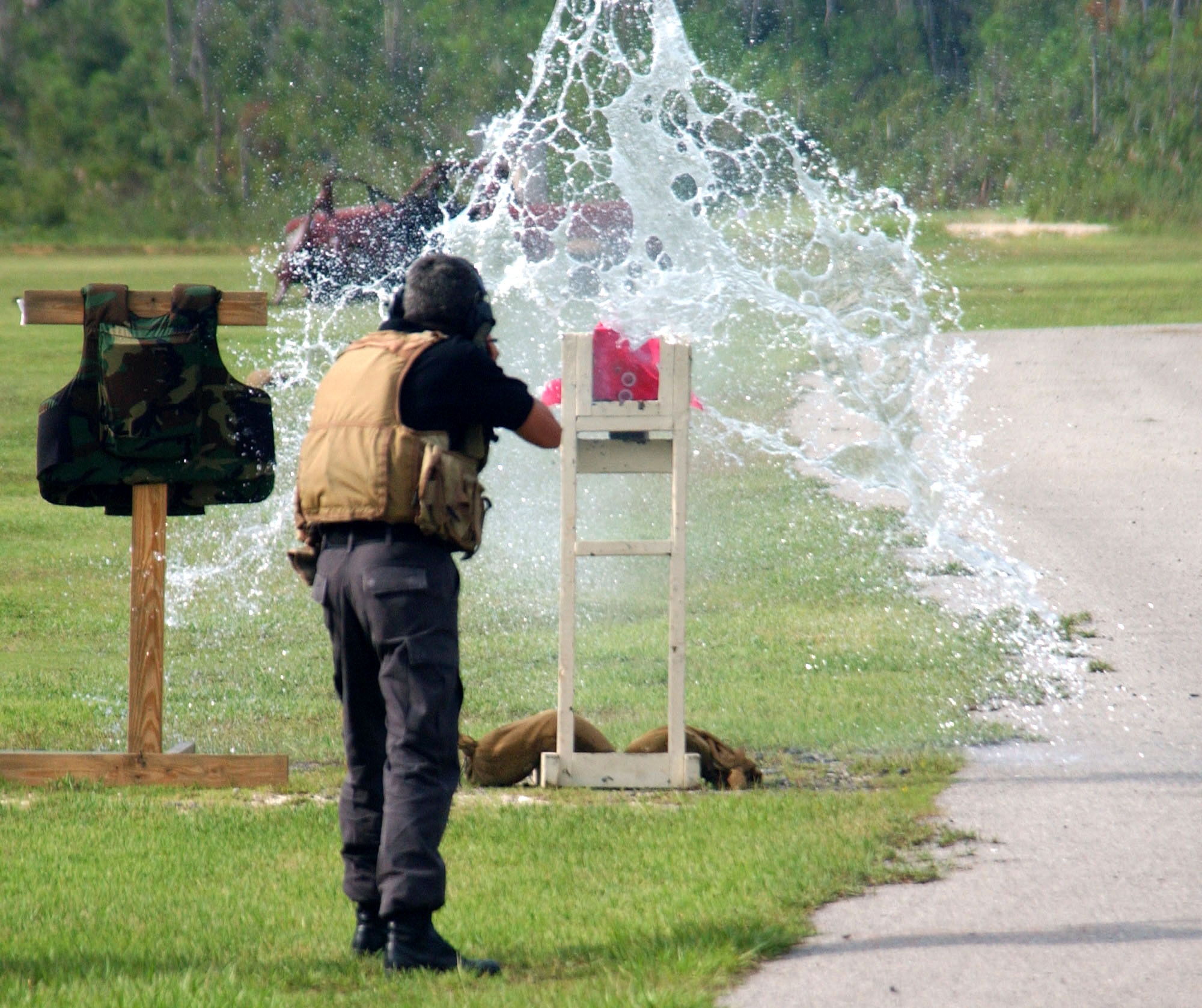 Master Sgt. Justin Anderson demonstrates the effectiveness of the AK-47 assault rifle against armored glass for students in the U.S. Air Force Special Operations School's Dynamics of International Terrorism course at Hurlburt Field, Fla., Sept. 13. The course offers students a basic awareness of the motivation, capabilities and threat posed by terrorist groups. Sergeant Anderson is an instructor at the course. (U.S. Air Force photo/Chief Master Sgt. Gary Emery)