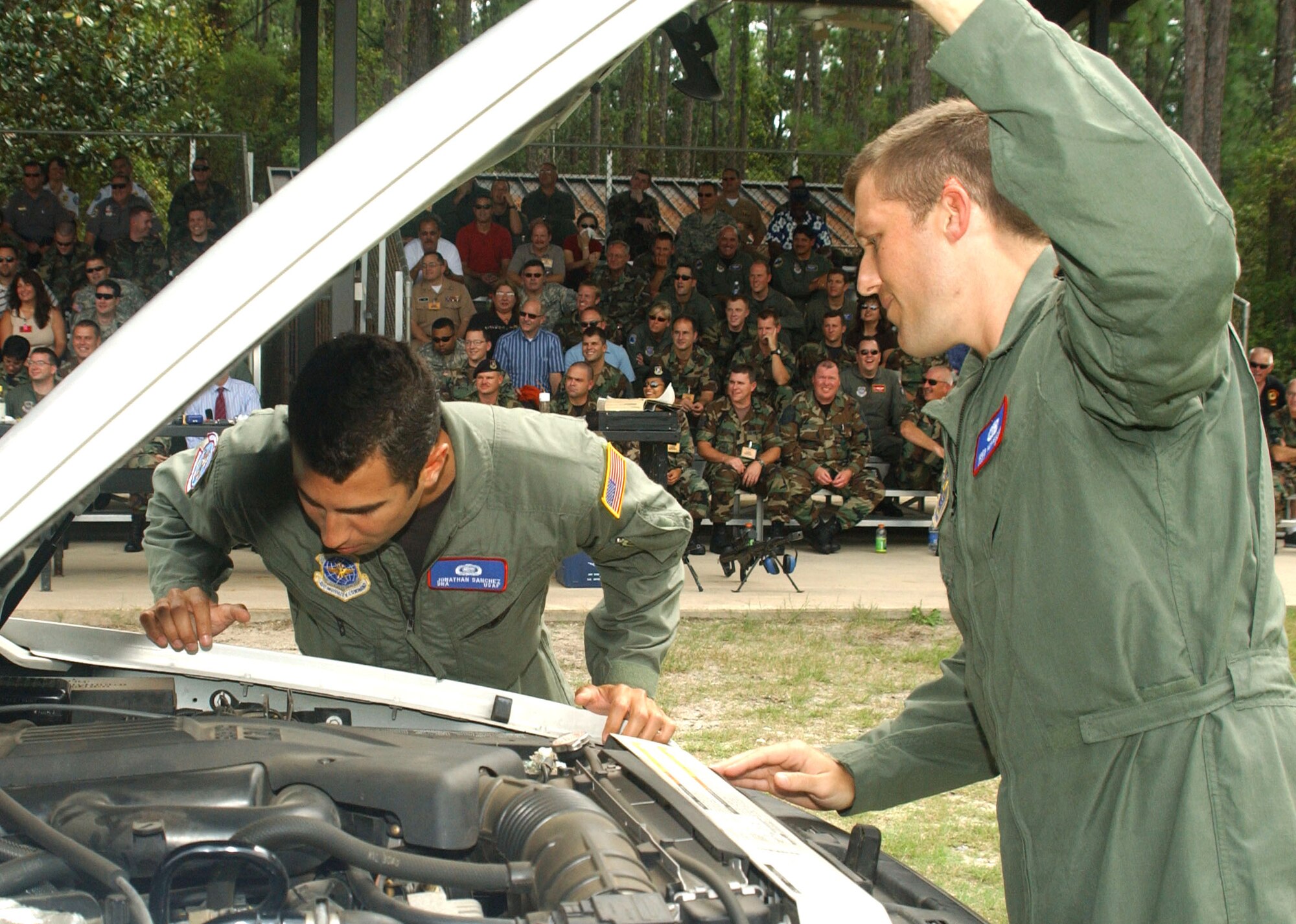 Senior Airman Jonathan Sanchez (left) and Staff Sgt. Greg Nercessian inspect a vehicle for explosive devices during training at Hurlburt Field, Fla., Sept. 13. The Airmen are attending the U.S. Air Force Special Operations School's Dynamics of International Terrorism course, which offers students a basic awareness of the motivation, capabilities and threat posed by terrorist groups. The Airmen are with the 452nd Operational Support Squadron at March Air Reserve Base, Calif. (U.S. Air Force photo/Chief Master Sgt. Gary Emery)

