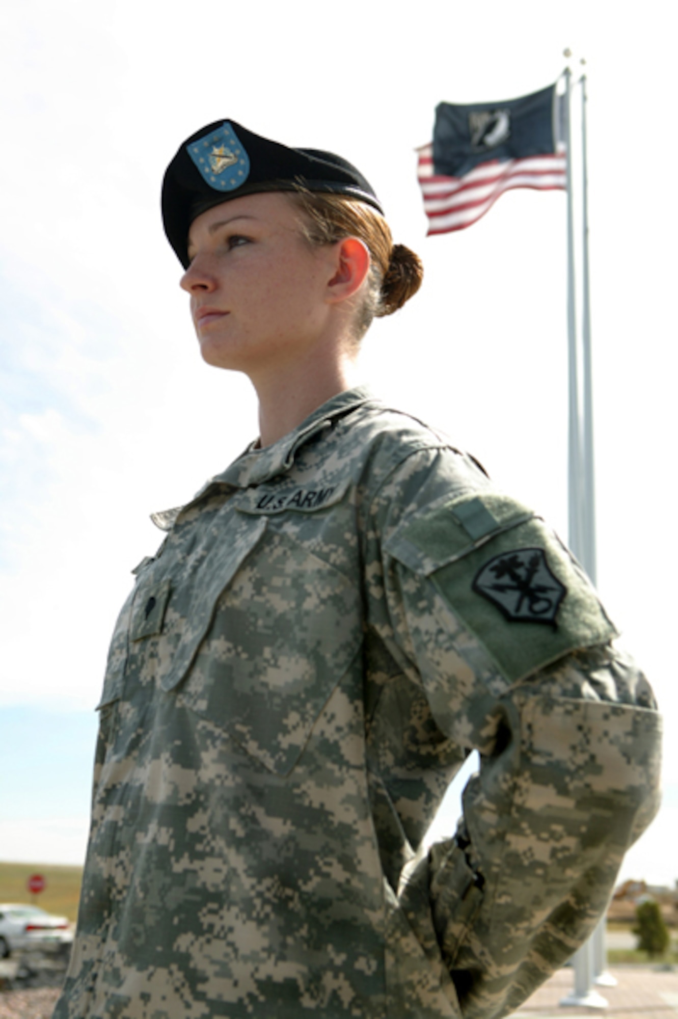 BUCKLEY AIR FORCE BASE, Colo. -- Army Spc. Jaime Pinkerton stands watch during a POW-MIA vigil in front of the 460th Space Wing headquarters building Sept. 15. More than 130 Team Buckley members from all services took turns standing vigil in four-person teams for 15 minutes throughout the day to pay tribute on National POW/MIA Recognition Day. Specialist Pinkerton is assigned to the the 743rd Military Intelligence Battalion here. (U.S. Army photo by Sgt. 1st Class Christian Vargo)