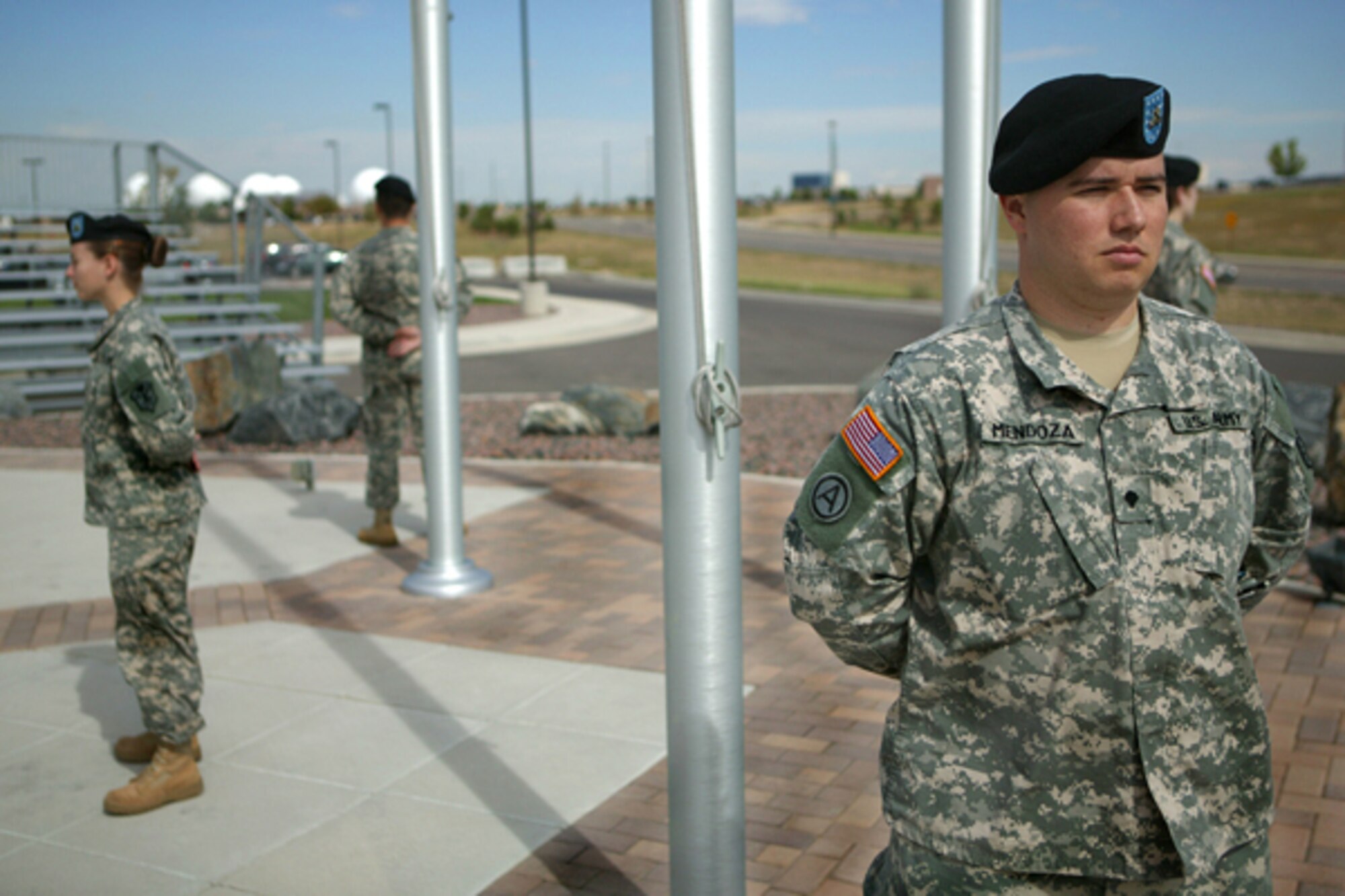 BUCKLEY AIR FORCE BASE, Colo. -- Army Spc. Matthew Mendoza and three other Soldiers stand watch during a POW-MIA vigil in front of the 460th Space Wing headquarters building Sept. 15. More than 130 Team Buckley members from all services took turns standing vigil in four-person teams for 15 minutes throughout the day to pay tribute on National POW/MIA Recognition Day. All of the Soldiers are from the 743rd Military Intelligence Battalion here. (U.S. Army photo by Sgt. 1st Class Christian Vargo)