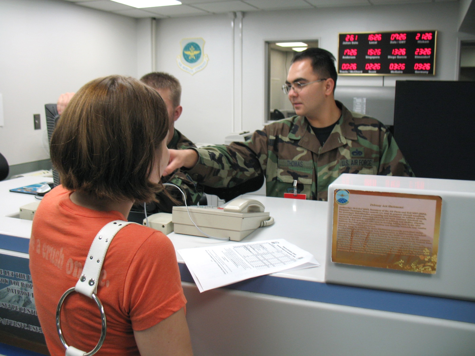 Staff Sgt. Robert Thomas assists passengers at the Yokota Air Base, Japan, passenger terminal Sept. 18. A native of Bremerton, Wash, Sergeant Thomas is a passenger service specialist assigned to the 730th Air Mobility Squadron.
(U.S. Air Force photo/Staff Sgt. Brendan Vargas)