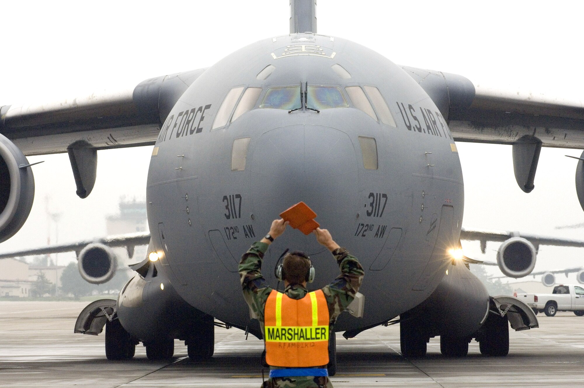 A C-17 Globemaster III is marshaled into its parking spot at Ramstein Air Base, Germany, after completing an aeromedical evacuation mission Sept. 18. The 791st Expeditionary Aeromedical Evacuation Squadron is flying aerovac missions from Ramstein supporting operations Iraqi Freedom and Enduring Freedom. (U.S. Air Force photo/Master Sgt. John E. Lasky) 
