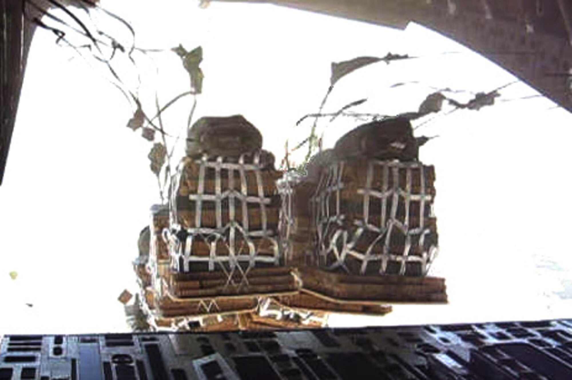 Airdrop Container Delivery System Bundles clear the ramp of a C-17 Globemaster III during a combat airdrop over Afghanistan Sept. 17. Members of the 817th Expeditionary Airlift Squadron, Detachment 1, at Manas Air Base, Kyrgyzstan, completed the mission by hitting two separate drop zones with more than 43,000 pounds of food, water and building supplies for troops on the ground. (U.S. Air Force photo)
