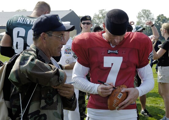 MCGUIRE AFB, NJ -- Air Force reservist Tech. Sgt. William Ciarrocchi gets an autograph from Jeff Garcia, backup quarterback for the Philadelphia Eagles August 14. Military members from the Delaware Valley spent the day at the Eagles Training Camp at Lehigh University meeting the players and watching the preseason practice as part of the team's military appreciation day. US Air Force Reserve photo by Kenn Mann 