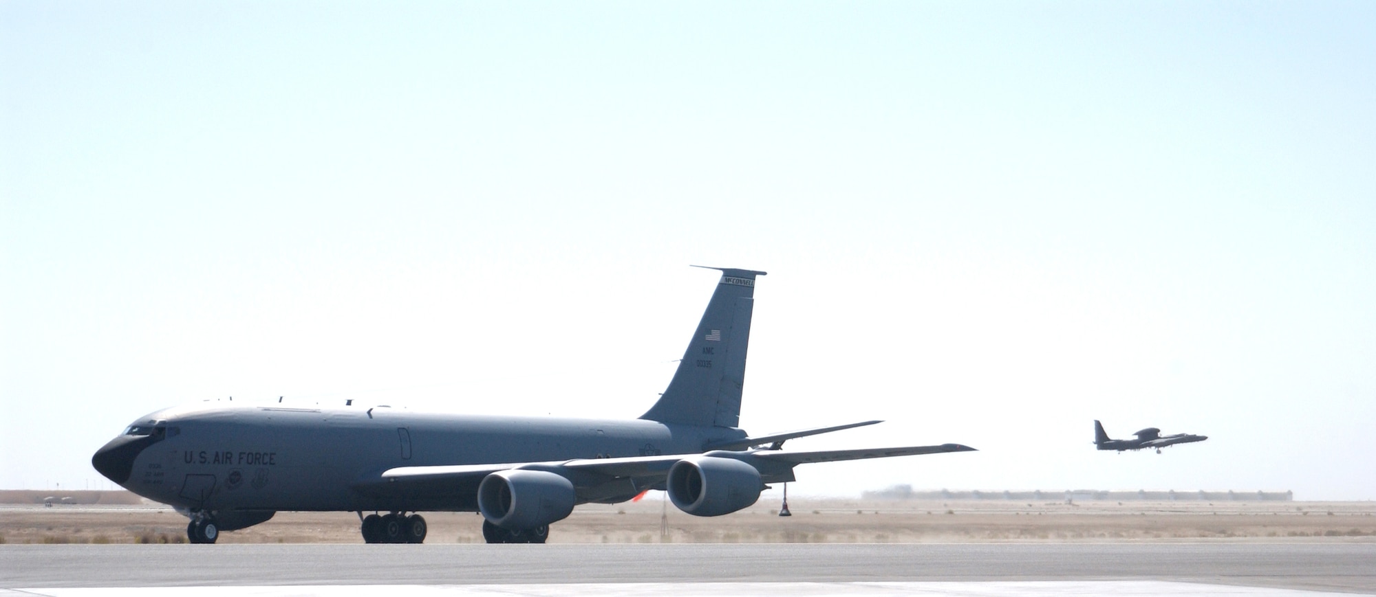 A U-2 "Dragonlady" lifts off from a forward-operating base in Southwest Asia as a KC-135 Stratotanker taxis toward the runway. Both aircraft play a role with the 380th Air Expeditionary Wing, which is also home to the largest air refueling squadron in theater. (U.S. Air Force photo/Master Sgt. Jason Tudor)
